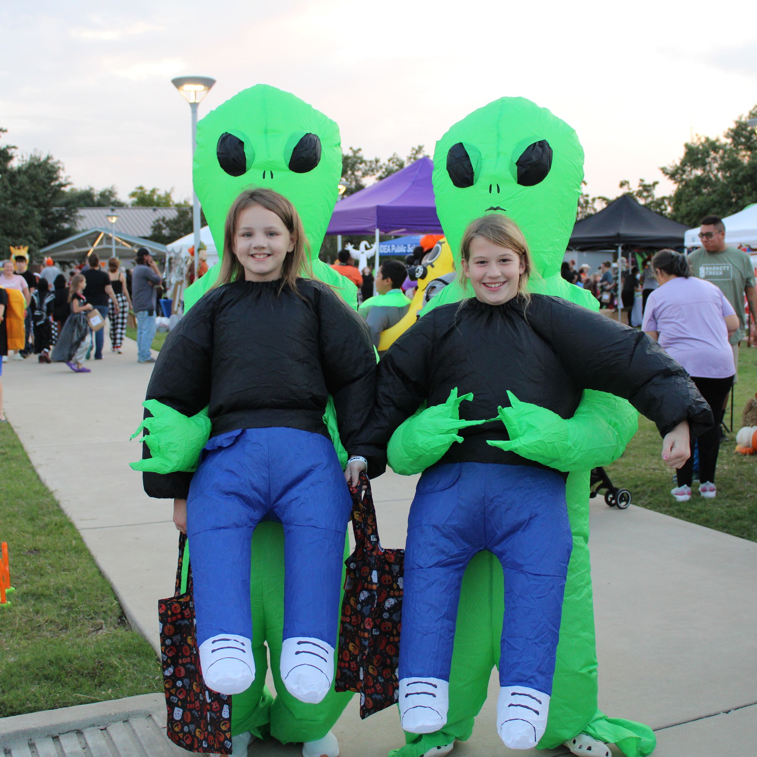 Two children in alien costumes